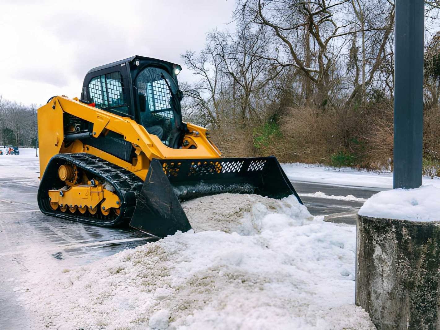 Commercial snow removal crew clearing a business parking lot