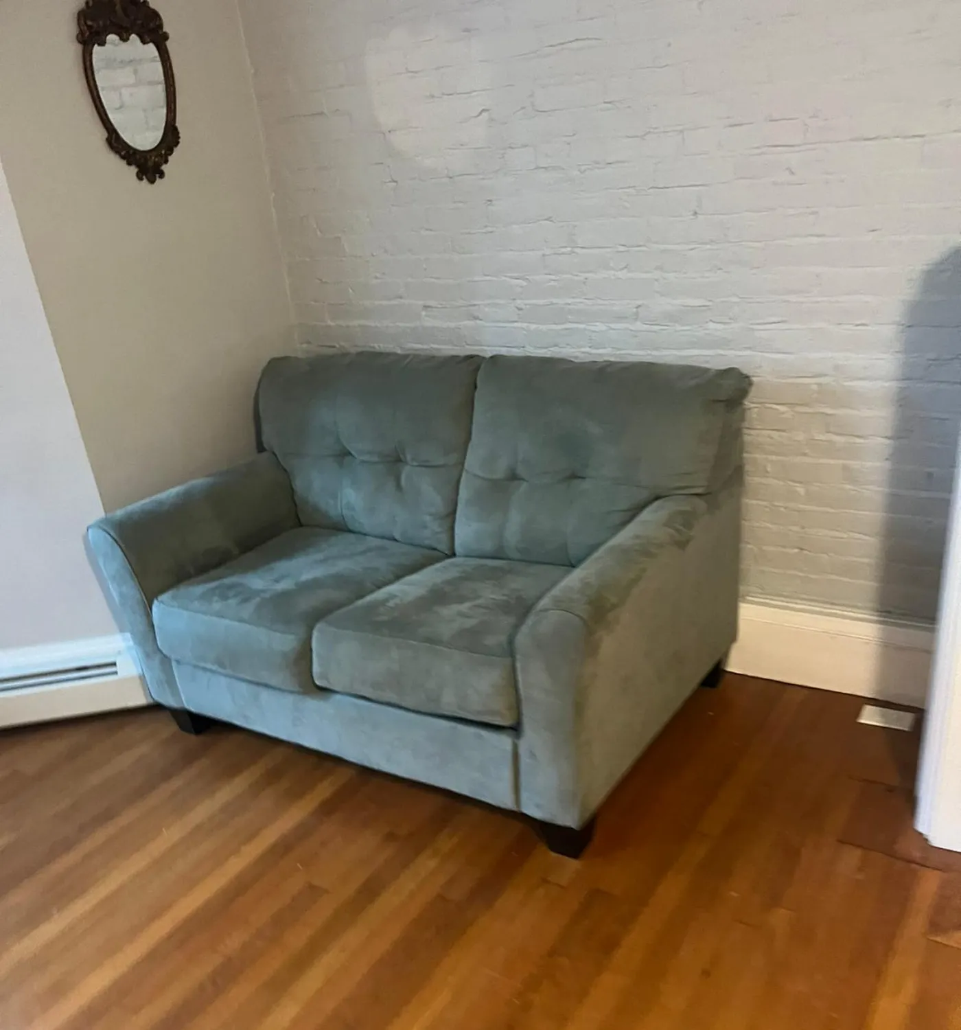Homeasy staff member cleaning a living room floor
