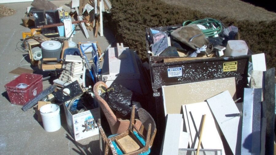 Space filled with junk and clutter before removal